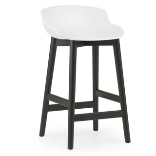 Normann Copenhagen Hyg black oak bar stool with polypropylene seat h. 65 cm. Normann Copenhagen Hyg White - Buy now on ShopDecor - Discover the best products by NORMANN COPENHAGEN design